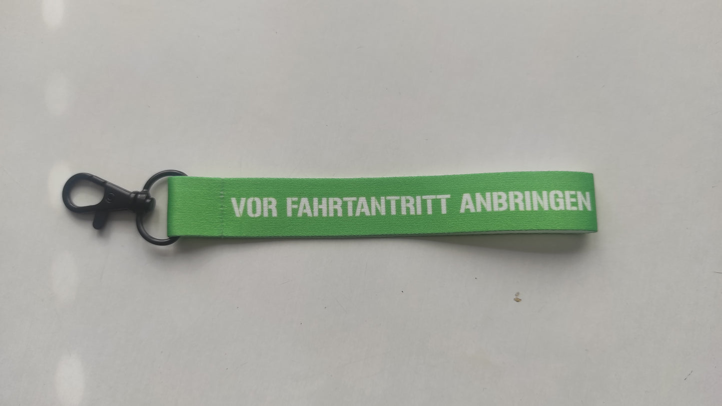 "vor Fahrtantritt anbringen" Schlüsselanhänger