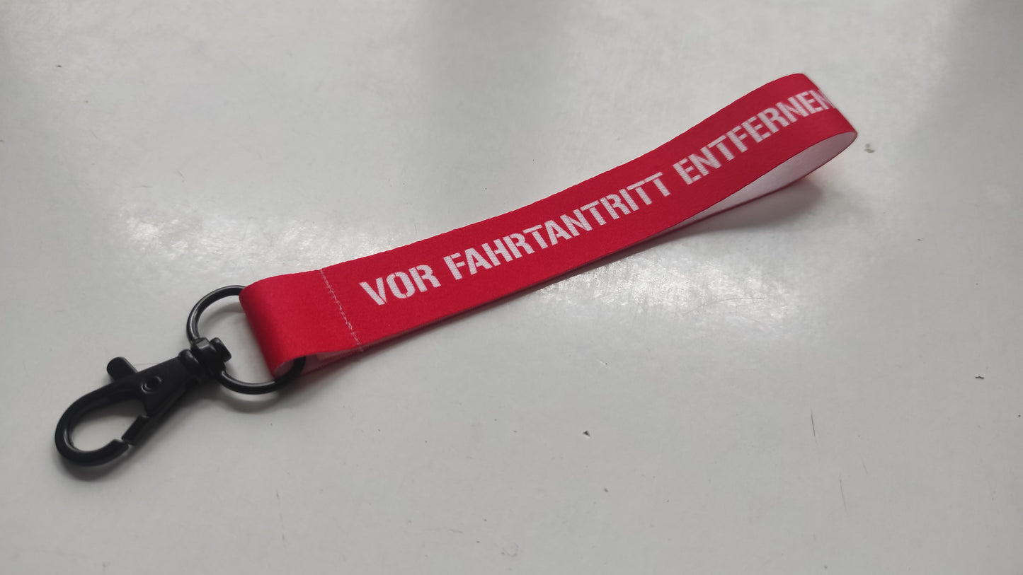 "vor Fahrtantritt entfernen" Schlüsselanhänger