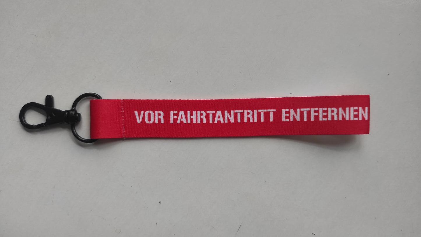 "vor Fahrtantritt entfernen" Schlüsselanhänger